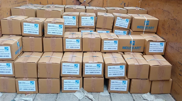 INDUSKART coded cartons wall-to-wall in truck — BOQ dispatch